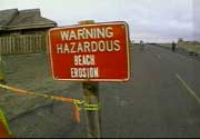 Photo: Sign reading: Warning Hazardous beach Erosion"